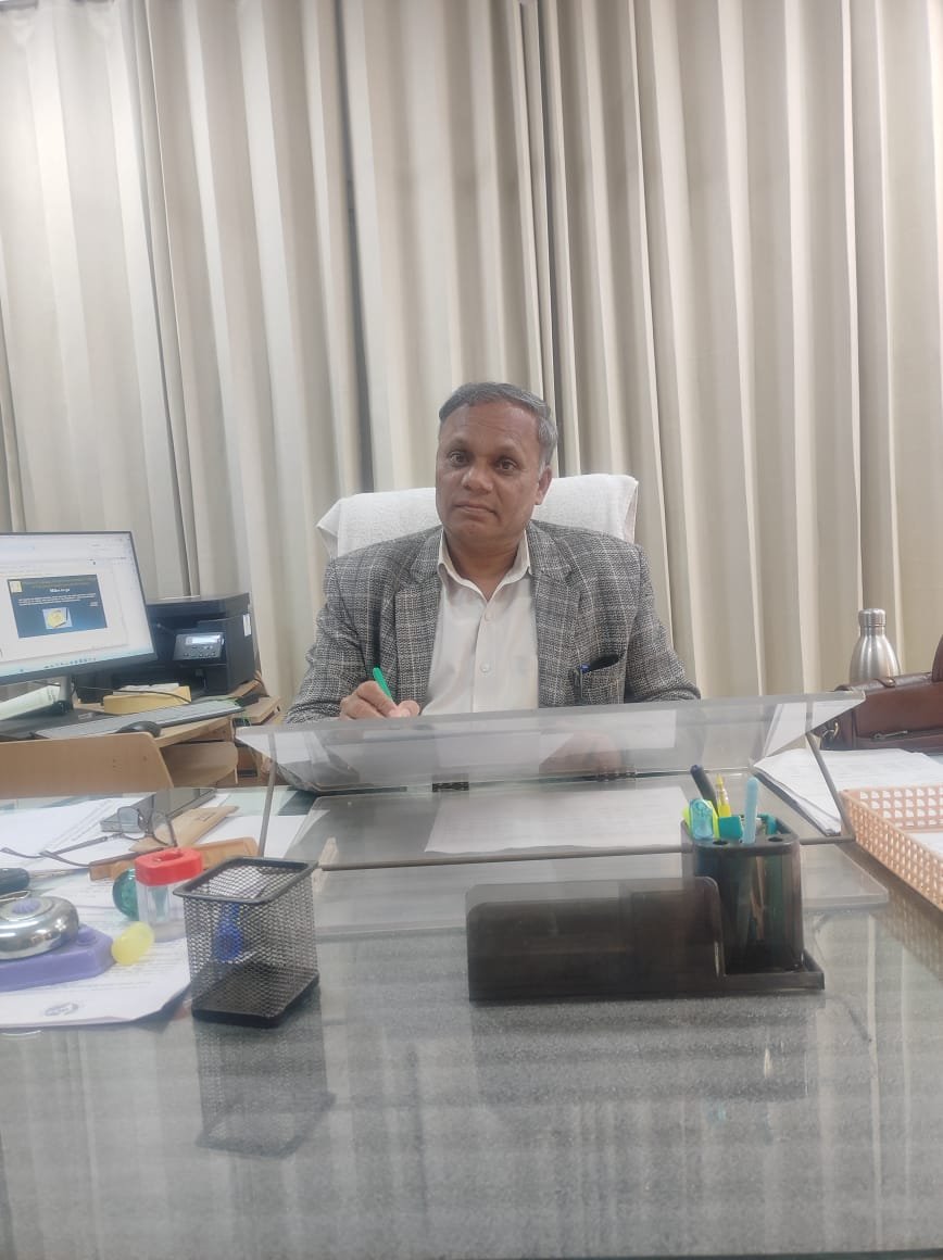 Portrait of Dr. Rajesh Sharma, Principal of Shaheed Udham Singh Government College